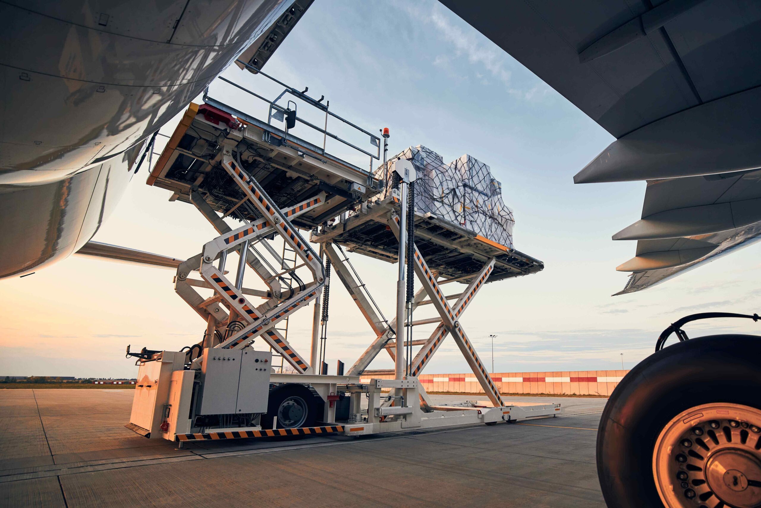 loading-of-cargo-containers-to-airplane-at-sunset-2025-02-16-11-29-13-utc (1) (1)